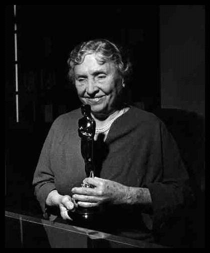 Helen Keller holding her Oscar award c. 1954